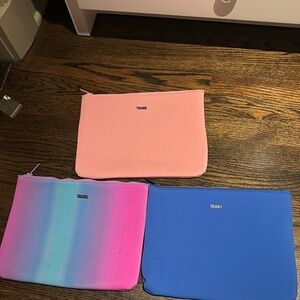 triangl swimwear Pink, Gradient Teal-Pink, and Blue Neoprene Pouch Trio